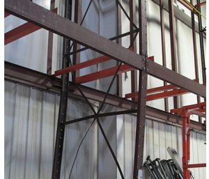 Damaged pallet rack bracing caused by forklift impact